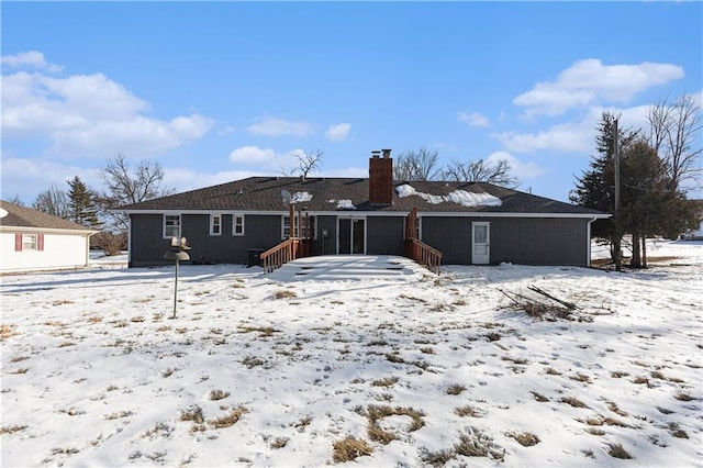 view of snow covered house