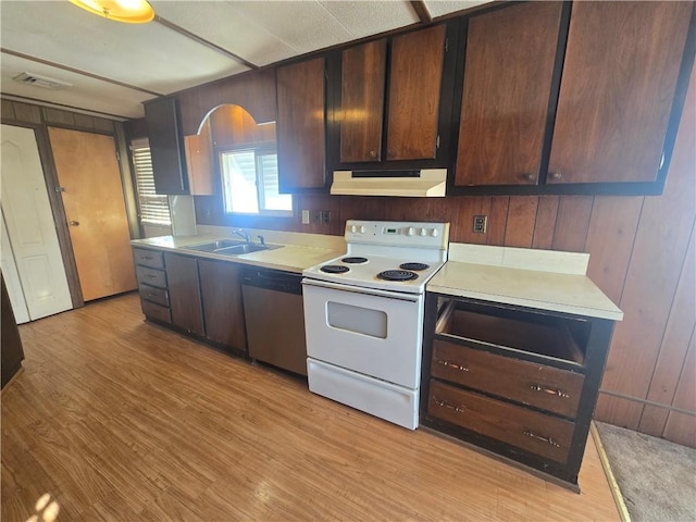 kitchen with stainless steel dishwasher, white electric range oven, wooden walls, dark brown cabinets, and sink