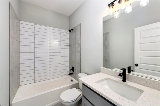 full bathroom with toilet, vanity, and tiled shower / bath combo