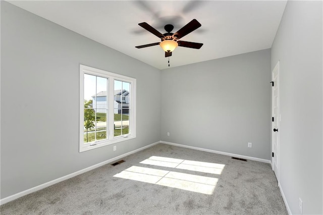 carpeted empty room with ceiling fan