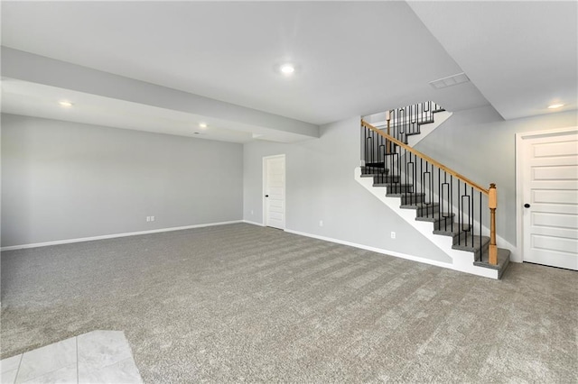 unfurnished living room featuring light carpet