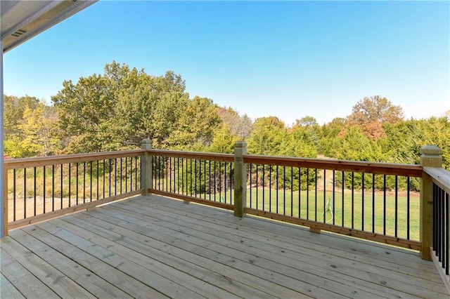 deck featuring a lawn