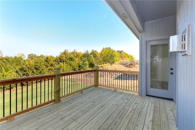 wooden deck with a yard