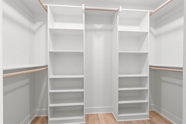 spacious closet featuring hardwood / wood-style floors