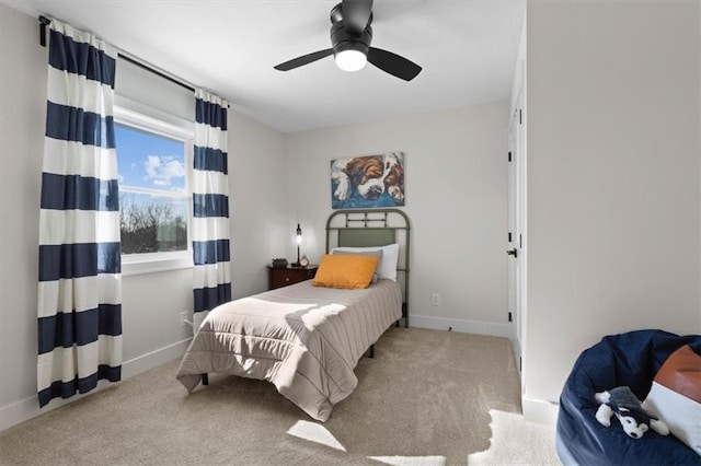 bedroom featuring ceiling fan and light colored carpet