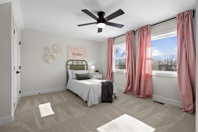 bedroom with ceiling fan and light colored carpet