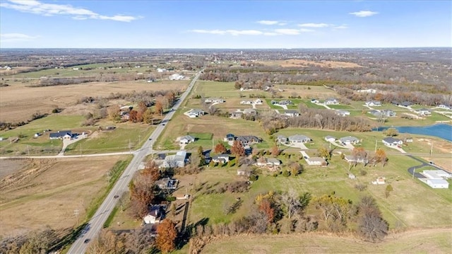 aerial view with a water view and a rural view