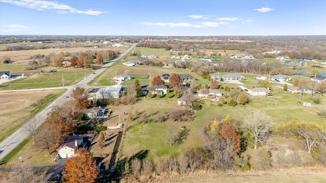 birds eye view of property with a rural view