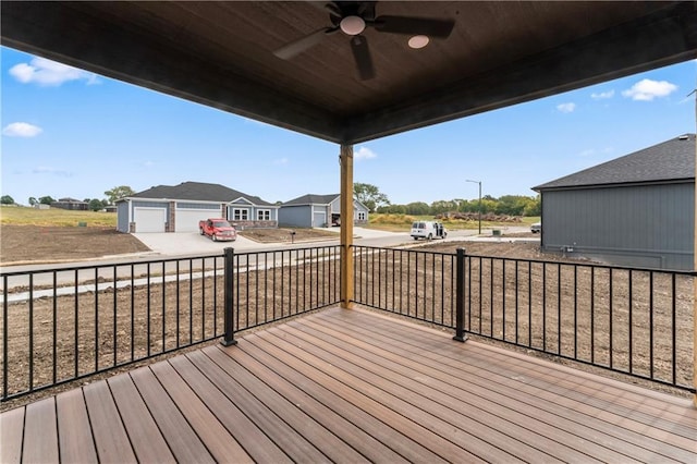 deck featuring an outbuilding and ceiling fan