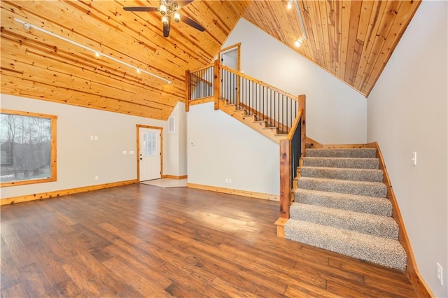 stairway featuring ceiling fan, wood ceiling, hardwood / wood-style flooring, and high vaulted ceiling