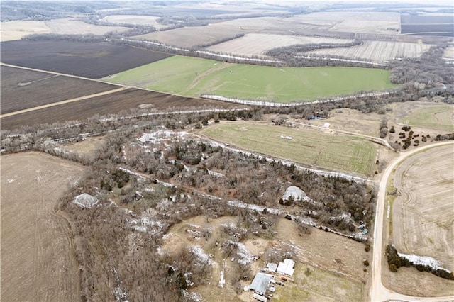 birds eye view of property with a rural view