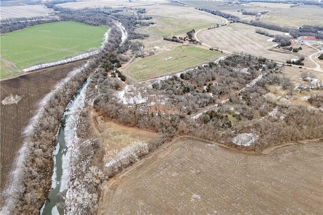 aerial view with a rural view and a water view