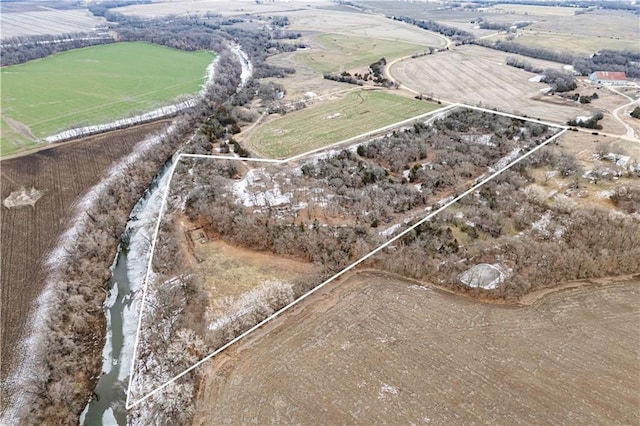 birds eye view of property with a rural view