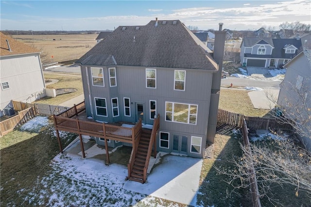 back of house with a wooden deck