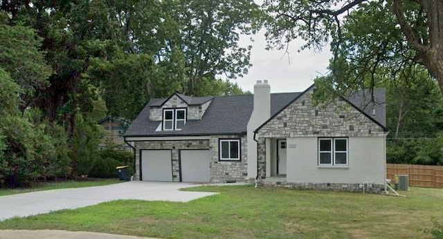 view of front of property featuring a front yard and central AC unit