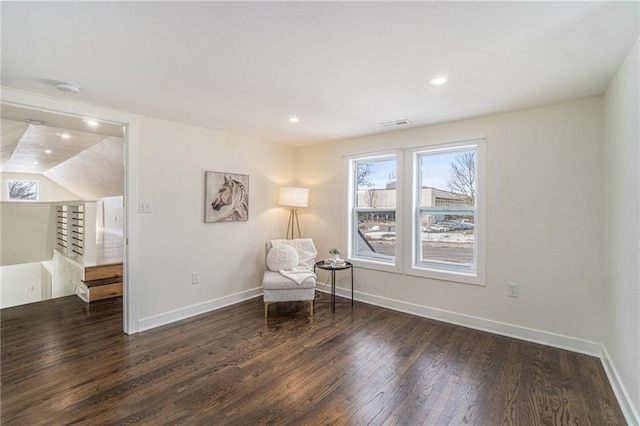 unfurnished room featuring dark hardwood / wood-style flooring and vaulted ceiling