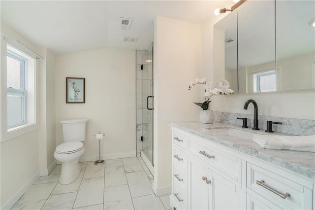 bathroom with vanity, a shower with shower door, and toilet