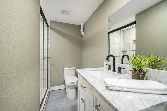 bathroom with a shower with door, toilet, and vanity