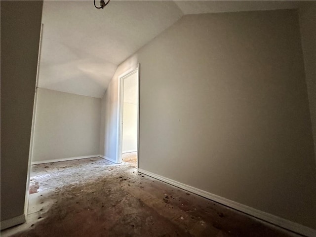 additional living space featuring vaulted ceiling