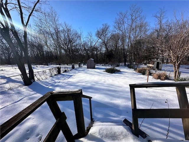 view of yard layered in snow