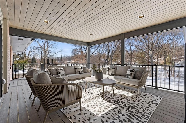 snow covered deck with an outdoor hangout area