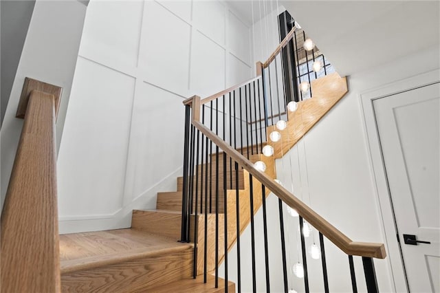 stairs featuring wood-type flooring