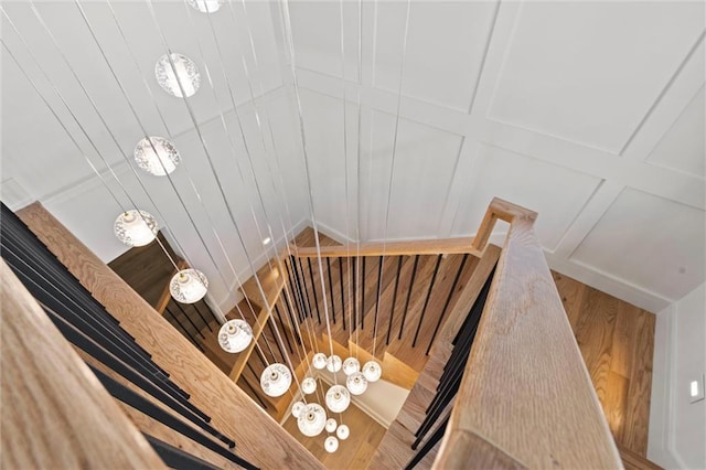 stairs featuring hardwood / wood-style flooring