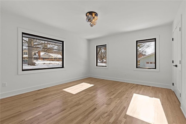 spare room with light wood-type flooring