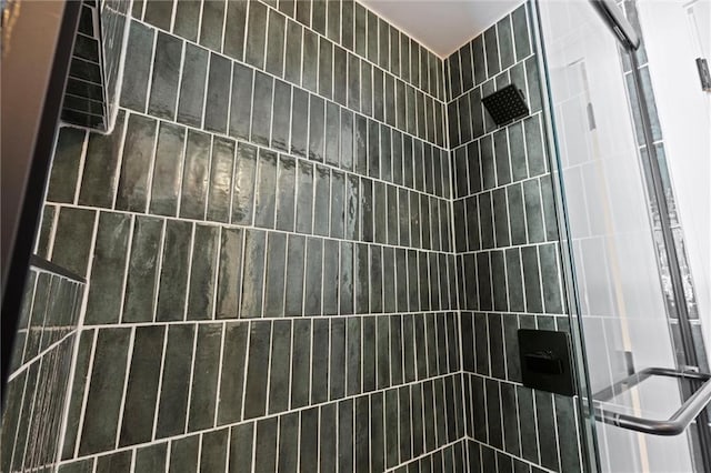 bathroom with tiled shower