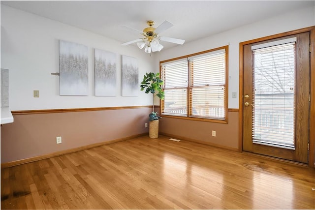 spare room with ceiling fan and light hardwood / wood-style flooring