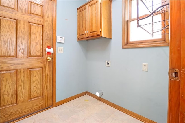 laundry room with cabinets and electric dryer hookup