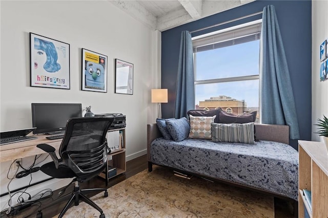 home office with baseboards and wood finished floors