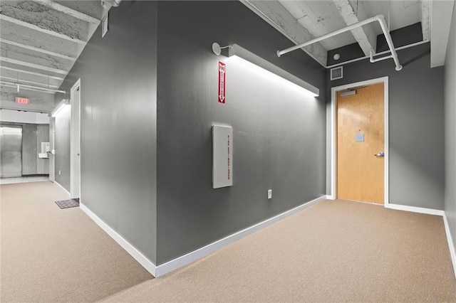 interior space featuring carpet floors and baseboards