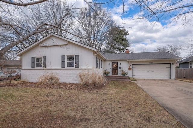 single story home with a garage and a front yard