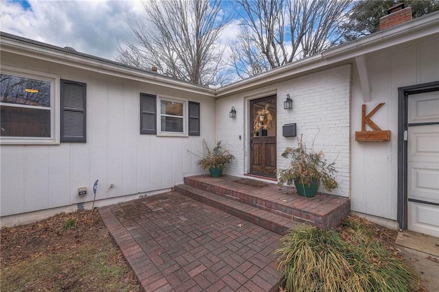 doorway to property featuring a patio area