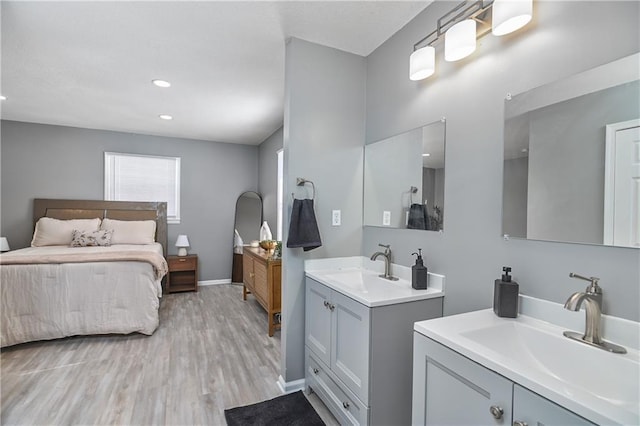 bathroom featuring wood-type flooring and vanity