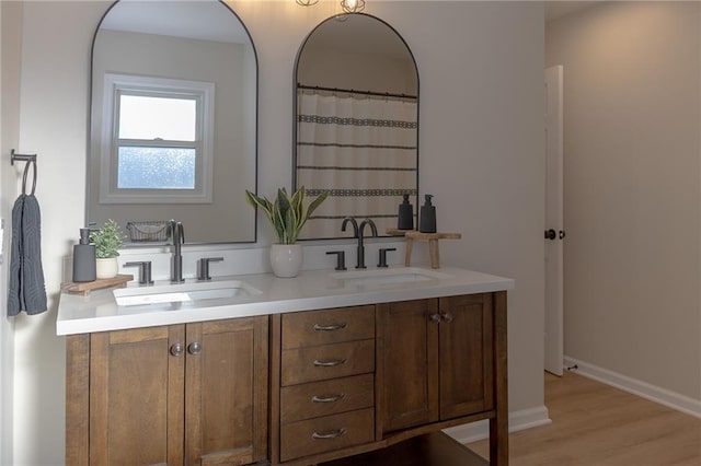 bathroom featuring vanity and hardwood / wood-style floors