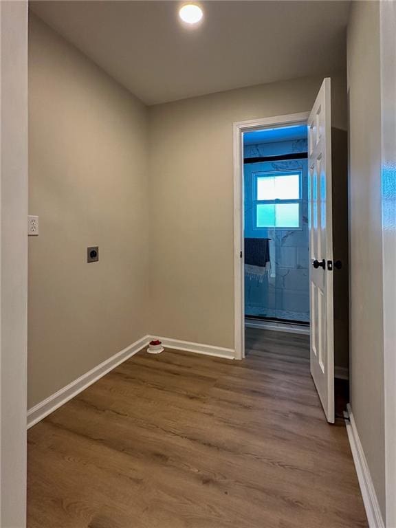 washroom featuring hardwood / wood-style flooring and hookup for an electric dryer