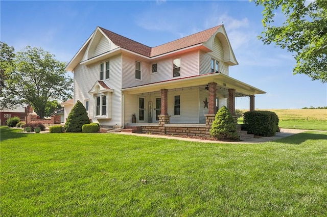 view of front of property with a front lawn and a porch