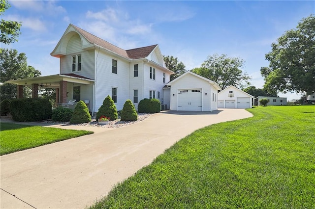 view of front facade with a front lawn, covered porch, and a garage