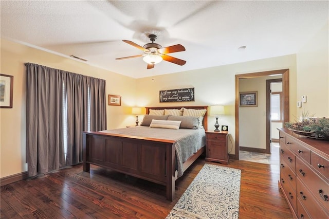 bedroom with ceiling fan and dark hardwood / wood-style flooring