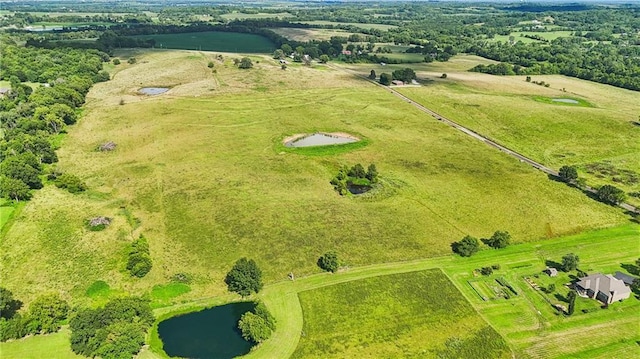 aerial view featuring a water view and a rural view