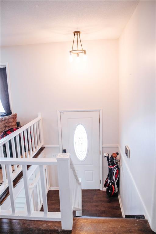 entryway with hardwood / wood-style flooring