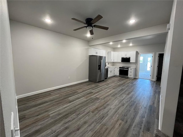 kitchen with ceiling fan, appliances with stainless steel finishes, dark wood-type flooring, white cabinets, and sink