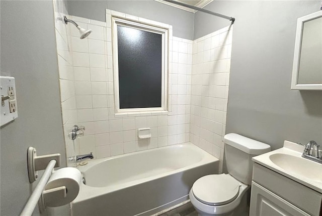 full bathroom with toilet, tiled shower / bath, crown molding, and vanity