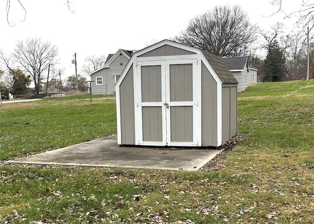 view of outbuilding with a yard