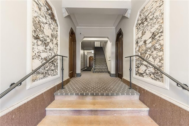 staircase featuring crown molding