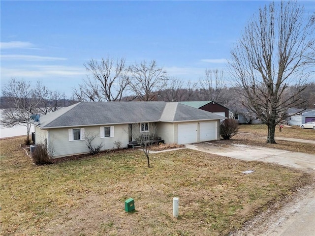 ranch-style house with a garage and a front yard