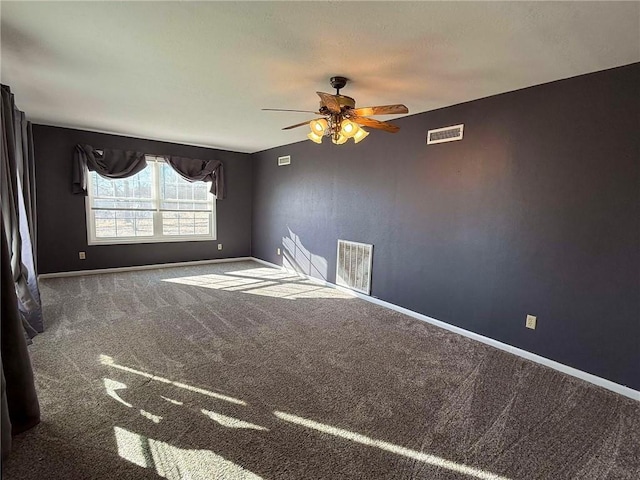 empty room with ceiling fan and carpet flooring