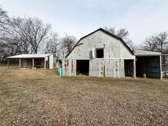 view of outbuilding featuring a yard